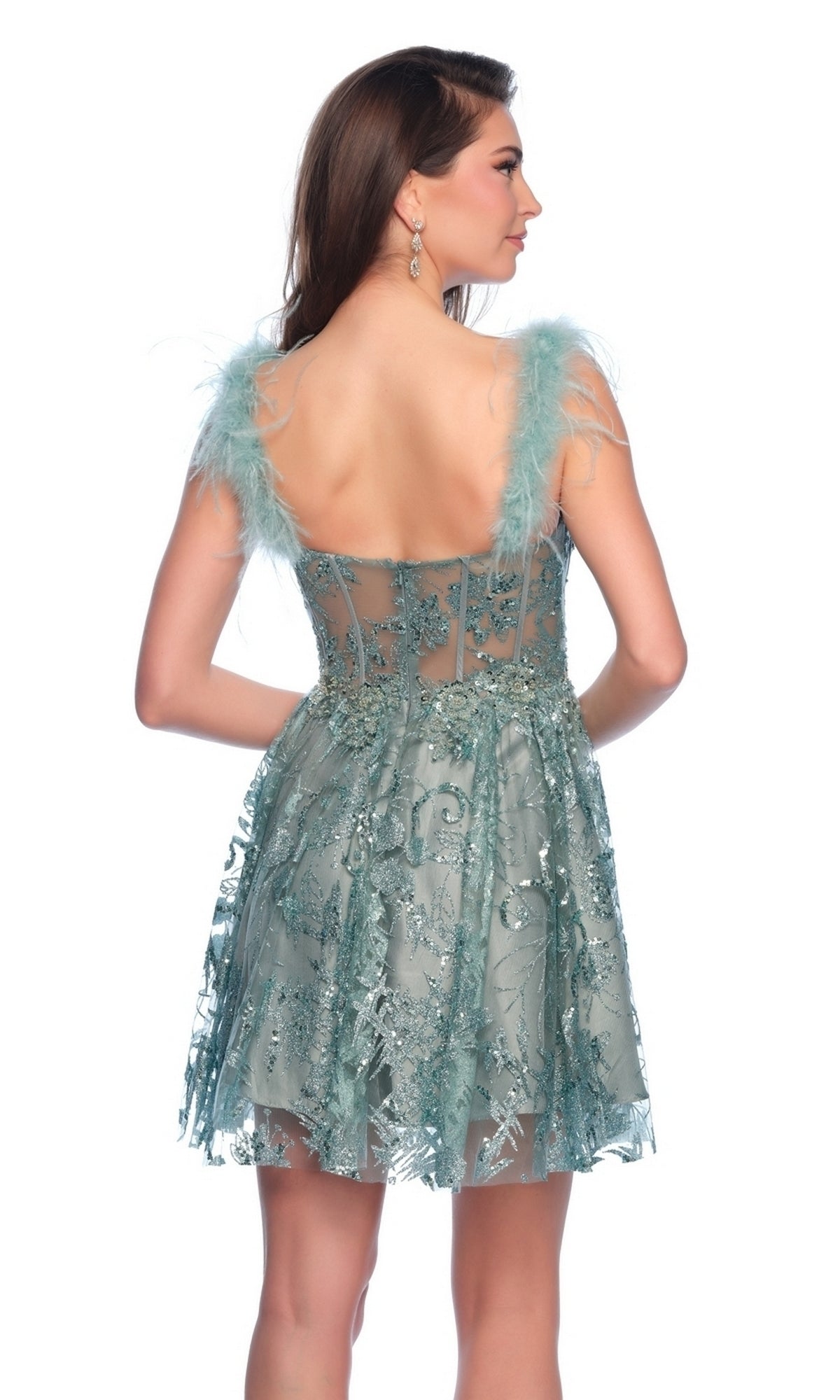 A woman stands facing away, wearing a Dave & Johnny Short Green Sequin Hoco Dress 11908.